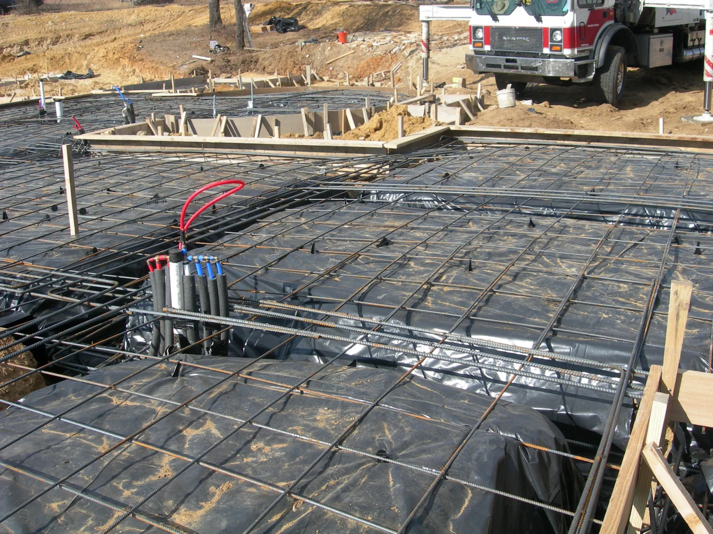 Foundation preparation with steel reinforcement at an Evolve construction site